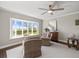 Comfortable living room featuring a bay window, ceiling fan, and modern decor at 2087 Edgewater Dr # C, Clearwater, FL 33755