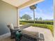 Inviting patio featuring cozy seating and scenic views of manicured gardens and serene waterfront at 2087 Edgewater Dr # C, Clearwater, FL 33755