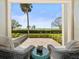 Charming patio showcasing comfortable seating and tranquil views of lush greenery and the serene waterfront at 2087 Edgewater Dr # C, Clearwater, FL 33755