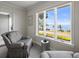 Cozy sitting area enjoys abundant natural light and stunning waterfront views at 2087 Edgewater Dr # C, Clearwater, FL 33755