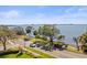 Scenic street view of a waterfront home with lush landscaping and bay views at 2087 Edgewater Dr # C, Clearwater, FL 33755