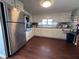 Efficient kitchen featuring updated appliances, ample cabinetry, and a bright window overlooking the sink at 2331 Belleair Rd # 904, Clearwater, FL 33764