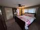 Comfortable bedroom with a ceiling fan, cozy bedding, and ample closet space for a serene retreat at 2331 Belleair Rd # 904, Clearwater, FL 33764