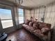 Sun room with tile flooring, a sofa, windows, and natural light at 2331 Belleair Rd # 904, Clearwater, FL 33764