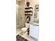 Well-decorated bathroom with a glass-door shower, stylish fixtures, shelving, and elegant decorative elements at 2511 N Grady Ave # 82, Tampa, FL 33607