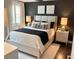 Modern bedroom featuring a neutral color palette, comfortable king-size bed, and stylish bedside tables with elegant lamps at 2511 N Grady Ave # 82, Tampa, FL 33607