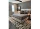 Comfortable bedroom with a modern bed frame, stylish rug, and soft neutral colors at 2511 N Grady Ave # 82, Tampa, FL 33607