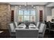 Modern dining room featuring a stone accent wall, contemporary lighting, and stylish decor, perfect for entertaining guests at 2511 N Grady Ave # 82, Tampa, FL 33607