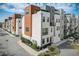 Modern townhome exterior with wood accents, a welcoming entrance, and professional landscaping at 2511 N Grady Ave # 82, Tampa, FL 33607