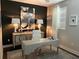 Bright home office with statement art piece, modern desk, and lamps adding style and elegance to the workspace at 2511 N Grady Ave # 82, Tampa, FL 33607
