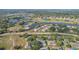 Scenic aerial view of a neighborhood with winding roads and multiple ponds at 2529 Lancaster Dr, Sun City Center, FL 33573