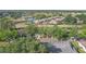 Beautiful aerial view of homes surrounding a pond in a lush green community at 2529 Lancaster Dr, Sun City Center, FL 33573