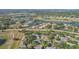 Expansive aerial view of a residential neighborhood with ponds and green spaces at 2529 Lancaster Dr, Sun City Center, FL 33573