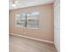Cozy bedroom with new floors, a large window, and closet creating a relaxing space at 2529 Lancaster Dr, Sun City Center, FL 33573