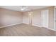 Bright bedroom with light-colored walls, ceiling fan, and light wood-look floors at 2529 Lancaster Dr, Sun City Center, FL 33573