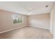 Serene bedroom with a large window, new floors, and ample space creating a peaceful retreat at 2529 Lancaster Dr, Sun City Center, FL 33573