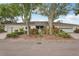 Home exterior with a well-maintained lawn, established trees, and a brick driveway, creating a warm ambiance at 2529 Lancaster Dr, Sun City Center, FL 33573