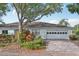Charming single-story home with a well-manicured lawn and paved driveway at 2529 Lancaster Dr, Sun City Center, FL 33573