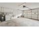 Spacious garage with laundry area, utility sink, and plenty of room for parking at 2529 Lancaster Dr, Sun City Center, FL 33573