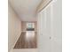 Hallway with wood floor and closet at 2529 Lancaster Dr, Sun City Center, FL 33573