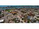 An aerial view shows the property located conveniently near a school, businesses, and entertainment at 340 83Rd Ave, St Pete Beach, FL 33706