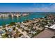 High angle shot showing a light-blue home in a bay-front community with parking and a beautiful view at 340 83Rd Ave, St Pete Beach, FL 33706