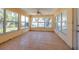 Bright sunroom filled with windows with tile floors awaits your personal touch and style at 340 83Rd Ave, St Pete Beach, FL 33706