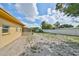 A view of the backyard with a fenced-in yard and plenty of space for recreation at 3491 58Th N St, St Petersburg, FL 33710