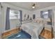 Inviting bedroom with hardwood floors, ample light, and soft blue accents at 3491 58Th N St, St Petersburg, FL 33710
