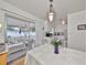 Open dining space featuring a sliding door to an outdoor patio, adjacent to the kitchen at 3491 58Th N St, St Petersburg, FL 33710