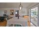 Bright dining room with white table, hardwood floors, and adjacent outdoor patio at 3491 58Th N St, St Petersburg, FL 33710
