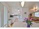 Cozy kitchen and dining area with white appliances and wood flooring at 3491 58Th N St, St Petersburg, FL 33710