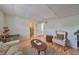 Cozy living area with a chair, sofa, and connection to the bathroom at 3491 58Th N St, St Petersburg, FL 33710