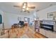 Bright living room featuring hardwood floors, natural light, and an adjacent dining area at 3491 58Th N St, St Petersburg, FL 33710
