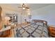 Bright main bedroom with hardwood floors, a ceiling fan, and a mirrored closet at 3491 58Th N St, St Petersburg, FL 33710