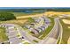 Aerial view featuring this home in a neighborhood near a large pond and new construction at 35260 Spruce Knob Ct, Dade City, FL 33525
