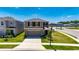 Aerial view of a two-story home on a corner lot with a well-kept lawn at 35260 Spruce Knob Ct, Dade City, FL 33525