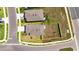 Aerial view of a property showcasing its layout, fenced backyard, and proximity to neighborhood amenities at 35260 Spruce Knob Ct, Dade City, FL 33525