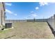 Fenced backyard with green lawn, ideal for play and relaxation at 35260 Spruce Knob Ct, Dade City, FL 33525