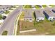 Aerial view of the home's private fenced backyard with green grass at 35260 Spruce Knob Ct, Dade City, FL 33525
