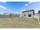 Expansive backyard with lush green grass, a privacy fence, and ample space for outdoor activities at 35260 Spruce Knob Ct, Dade City, FL 33525