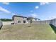 Spacious backyard features a well-maintained lawn, privacy fencing, and outdoor living space at 35260 Spruce Knob Ct, Dade City, FL 33525