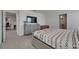 Well-lit bedroom features modern furnishings, backyard views, and access to an additional bathroom and workspace at 35260 Spruce Knob Ct, Dade City, FL 33525