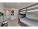 Shared bedroom showcasing a sturdy bunk bed and colorful decor, perfect for or guests at 35260 Spruce Knob Ct, Dade City, FL 33525