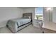 Bedroom featuring neutral colors, a dresser, a writing desk, luxury vinyl flooring, and lots of natural light at 35260 Spruce Knob Ct, Dade City, FL 33525