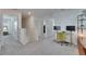 Upstairs hallway features neutral colors, a small workstation, and access to additional bedrooms and bathrooms at 35260 Spruce Knob Ct, Dade City, FL 33525