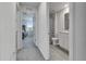 Bright hallway provides access to a bedroom with backyard views, and a bathroom with modern fixtures at 35260 Spruce Knob Ct, Dade City, FL 33525