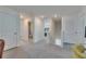 Upstairs hallway with access to bathroom and bedrooms, carpet flooring, and recessed lighting at 35260 Spruce Knob Ct, Dade City, FL 33525