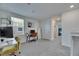 Bright hallway featuring neutral colors, a workstation, a linen closet, and access to an additional bedroom at 35260 Spruce Knob Ct, Dade City, FL 33525
