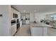 Bright white kitchen with stainless steel appliances and granite countertops at 35260 Spruce Knob Ct, Dade City, FL 33525